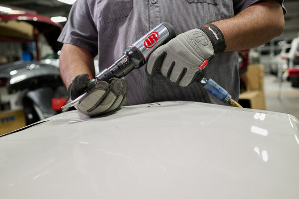 Compressed air chipping hammer from SET 135MAXK Ingersoll Rand, chipping hammer side view left in use